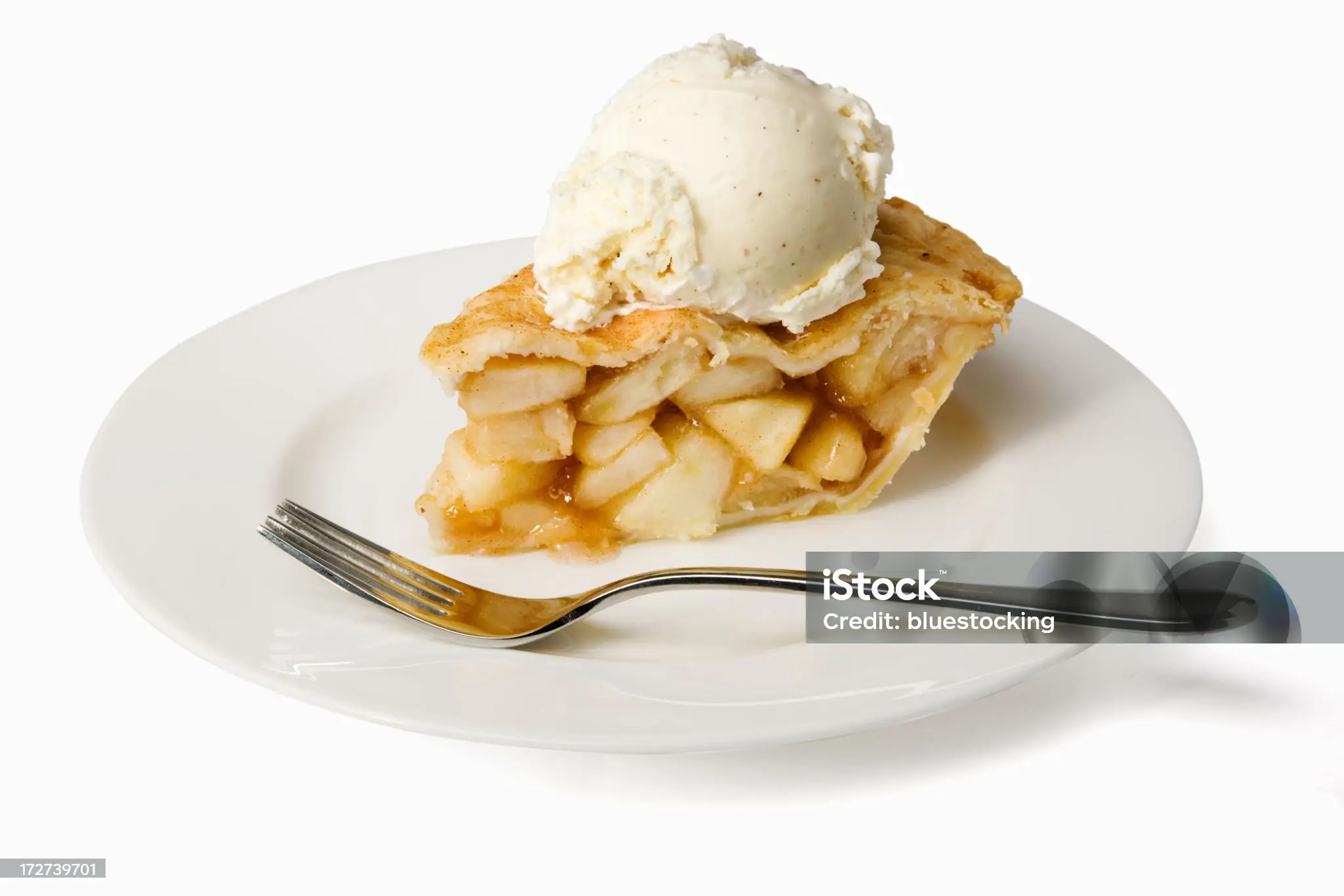 Apple pie with a scoop of vanilla ice cream.  Isolated on white with clipping path.
